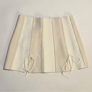 dion lee cream and white knit mini skirt